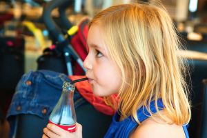 Young girl with soft drink | Child dental health