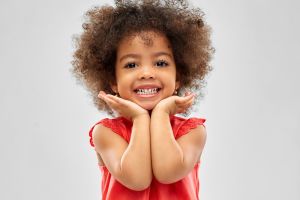 Smiling young girl in red shirt